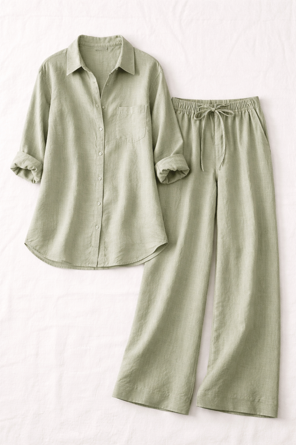 Voura linen co-ord set sage green shirt and wide-leg trousers flat lay white background