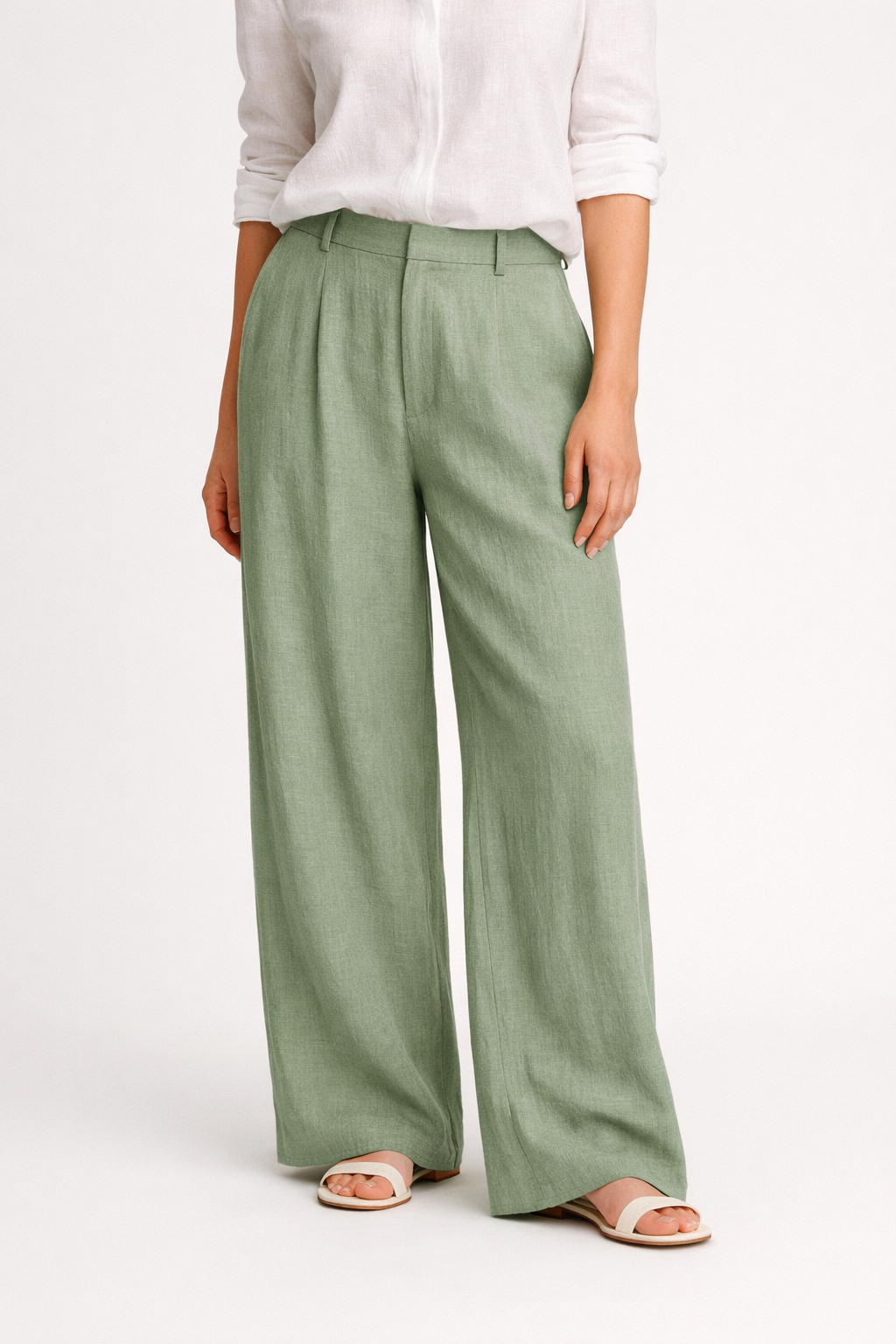 Vouraco linen wide-leg trousers sage green relaxed fit white studio background