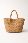 Voura natural woven raffia tote bag leather handles white studio background