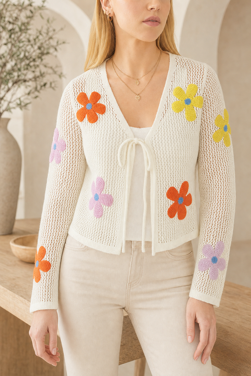 Crochet knit cardigan, flower applique, ivory — worn, lifestyle setting