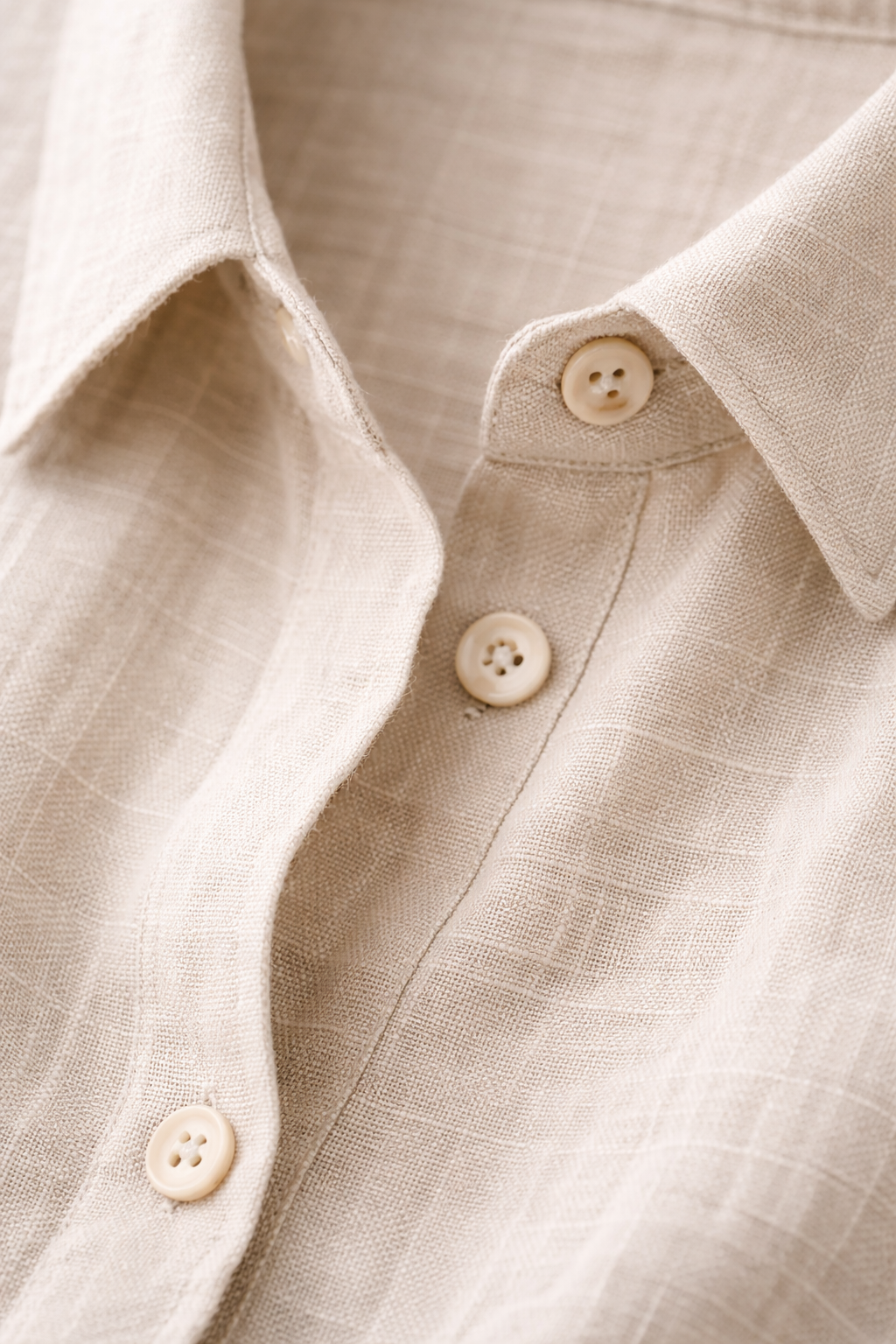Close-up linen shirt collar and chest pocket stitching detail
