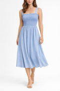Voura cobalt blue smocked sundress square neckline white studio background