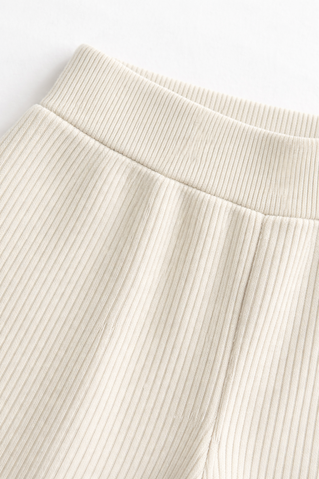 Close-up ribbed knit co-ord fabric texture fine rib detail cream colourway