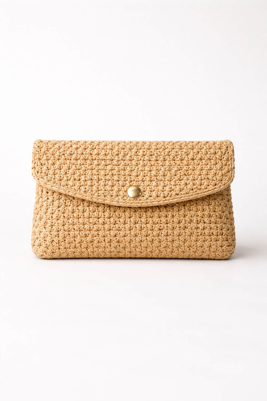 Voura natural raffia fold-over clutch bag evening occasion white studio background
